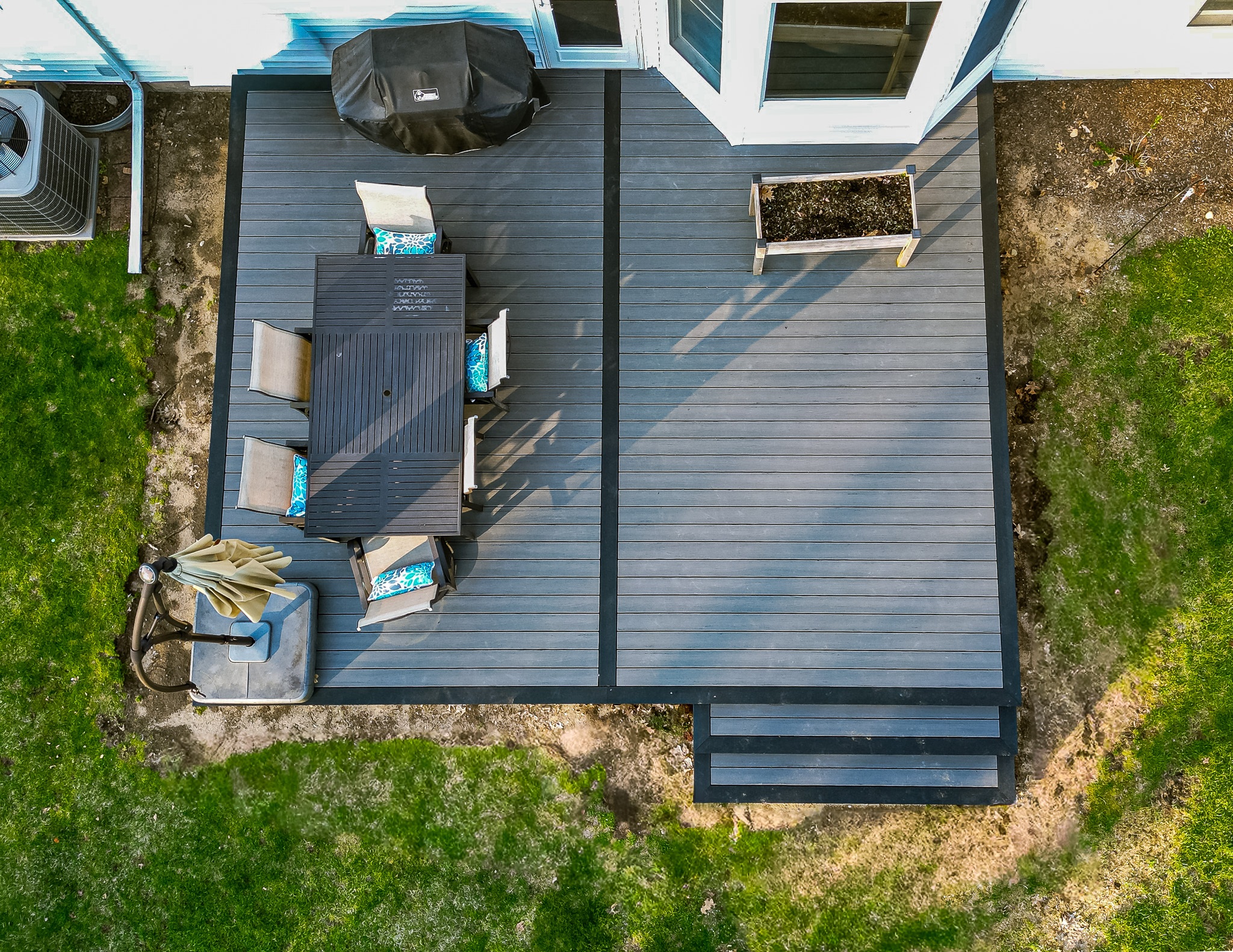 Green Shield Deck Builders | 333 Sq. Ft. Ash Gray deck featuring…