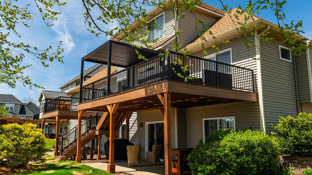 Featuring exposed KDAT framing and structurally reinforced stair stringers, this Green Shield Tigerwood deck layout pairs a clean aesthetic integration with a structural backbone built to last a lifetime.