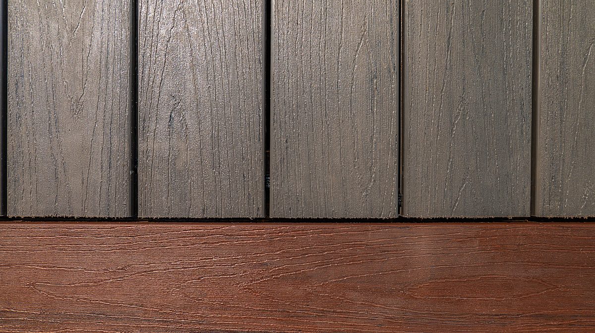Green Shield Deck Builders wood-free rice hull composite deck boards. Showcasing Ash Gray and Brazilian Cherry color options.